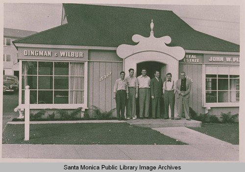 Agents stand outside of Dingman & Wilbur Real Estate office at 15327 Sunset Blvd. in Pacific Palisades