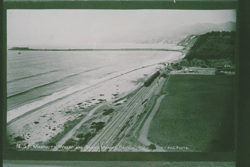 Railroad train travels past Santa Monica Canyon to the Long Wharf