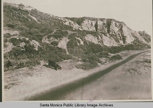 Automobile near a dirt road which would become Pacific Coast Highway