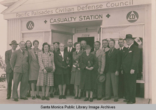 Volunteers stand in front of the Pacific Palisades Civil Defense Council Casualty Station