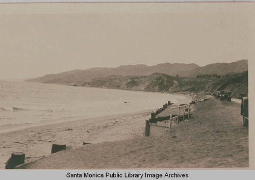 Automobiles parked at the bottom of Temescal Canyon looking toward the present day Bel Air Bay Club and Bernheimer Gardens