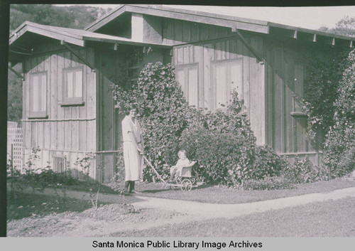 Zola Clearwater and her son, Louis Laird Clearwater., in front of their home