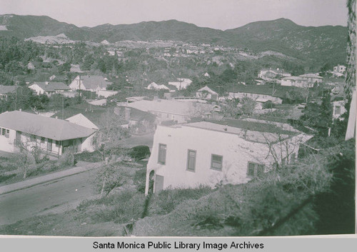 View looking into houses below Temescal Canyon with Radcliffe Avenue in the foreground