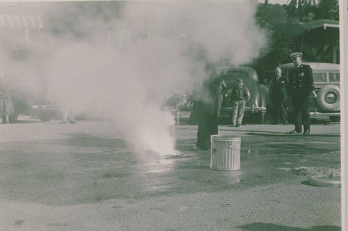 Firemen demonstrating how to extinguish phosphorus bombs in the event of an attack at Assembly Camp, Temescal Canyon, Calif