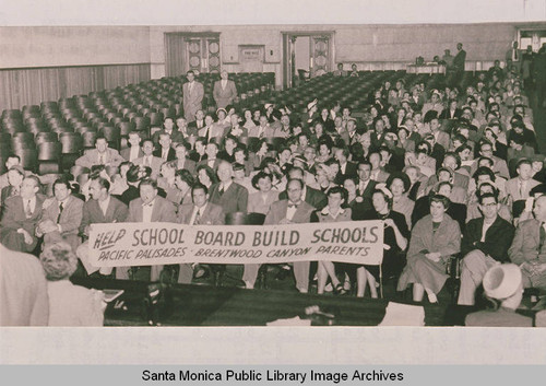 Banner "Help School Board Build Schools" held by parents lobbying for the construction of Paul Revere Jr. High School