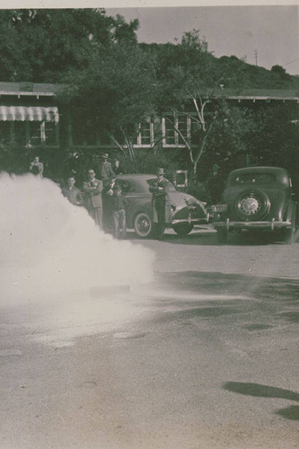 Firemen demonstrating how to extinguish phosphorus bombs in the event of an attack at Assembly Camp, Temescal Canyon, Calif