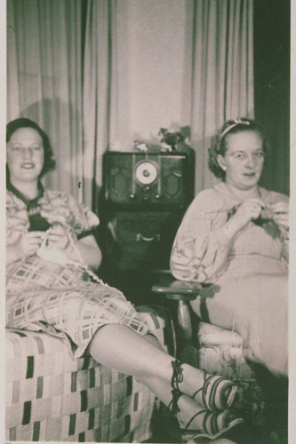 Frances Stewart and Frances Swartz listening to a radio program in the Stewart Apartment on Monument Street in Pacific Palisades