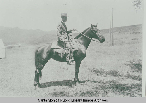 Clark Standiford (superintendent of construction) on horseback, Pacific Palisades, Calif