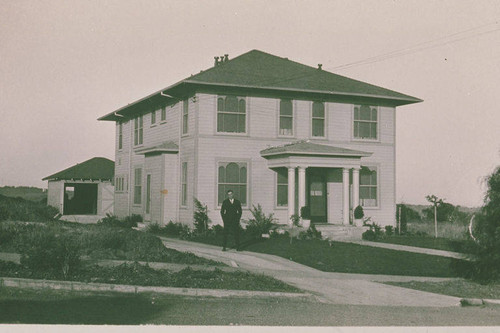 Dave Stadler in front of the house his family rented in Pacific Palisades, Calif