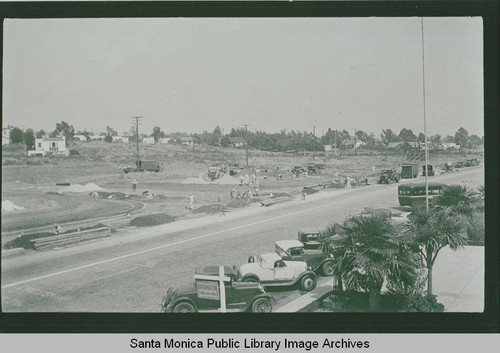 View of automobiles parked on Sunset Blvd. from the roof of the Pacific Palisades Business Block looking toward Monument Street