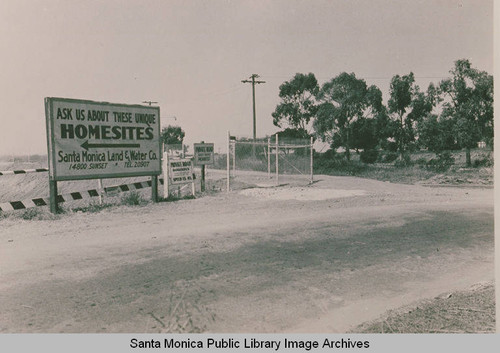 "Ask about our Uniques Homesites" a Santa Monica Land & Water Company sign advertising real estate in Pacific Palisades, Calif