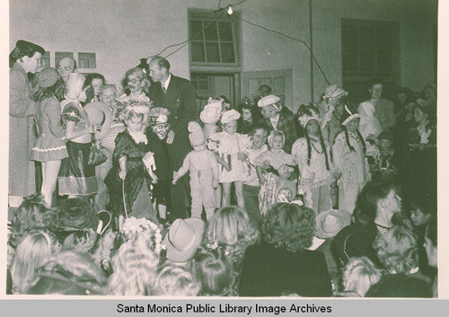 Children in costumes are gathered for a youth event in Pacific Palisades, Calif