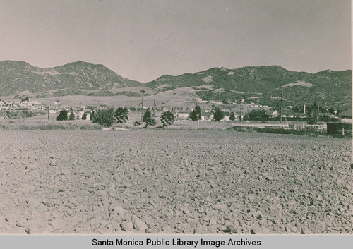 View of an open field toward Temescal Heights from West Mesa, Pacific Palisades, Calif