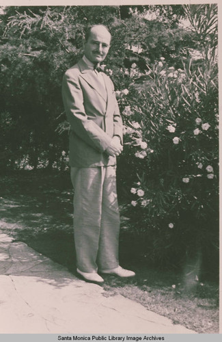 Unidentified man in a flower garden, Pacific Palisades, Calif