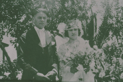 Bride and groom stand together at a Marquez family wedding in Santa Monica Canyon