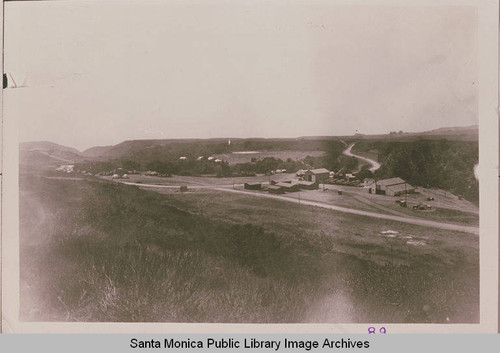 Looking down Temescal Canyon, Pacific Palisades, Calif. at the Assembly Camp Grading Center showing Sunset Blvd (then, known as Beverly Blvd.) running left to right