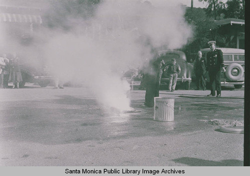 Firemen demonstrating how to extinguish phosphorus bombs in the event of an attack at Assembly Camp, Temescal Canyon, Calif