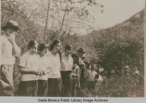 A group of children and adults hiking in Upper Temescal Canyon, Pacific Palisades, Calif