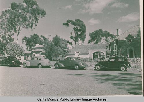 Cars parked on a street near Pacific Palisades Recreation Center showing Eucalptus trees in the background