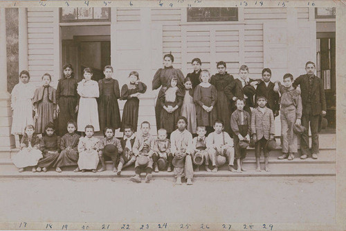 First class of the Canyon School, Santa Monica Canyon, with teacher Mina Norton (seventh from left, back row) and several children of Marquez family