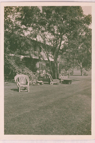 Lawn furniture rests on the landscape in front of the main house of Will Rogers at the Will Rogers Ranch, Rustic Canyon, Calif