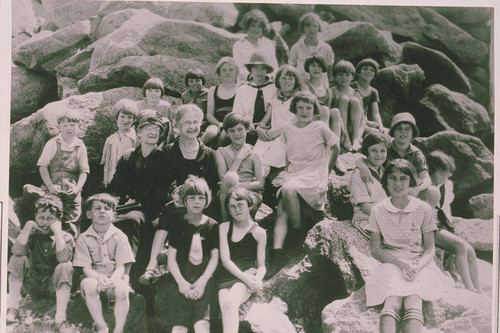 Children posing on rocks at the "Junior Church" Beach Picnic