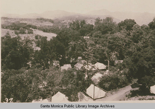 Oaks, tents and the mountains at the Assembly Camp, Temescal Canyon, Calif