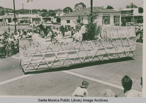 Women riding a float in the Pacific Palisades Fiesta Day Parade