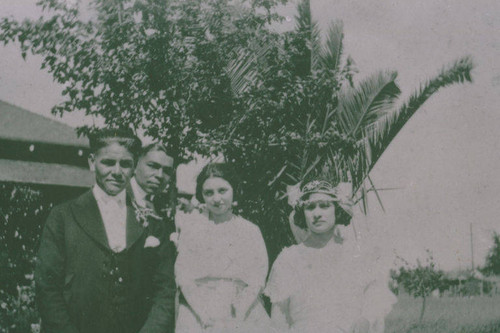 Bride, groom, and other family members stand together at a Marquez family wedding, Santa Monica Canyon