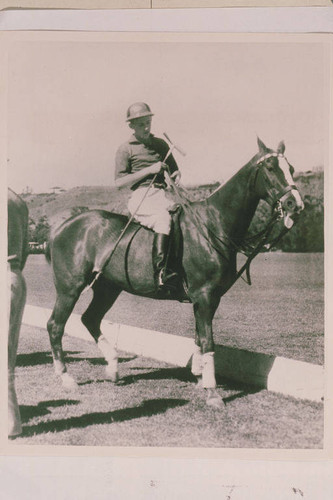 Will Rogers, Jr. on his horse dressed for Polo at the Uplifter's Ranch Polo Field, Calif