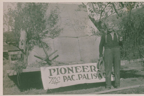 Man posing next to the Pacific Palisades Pioneer Days parade float