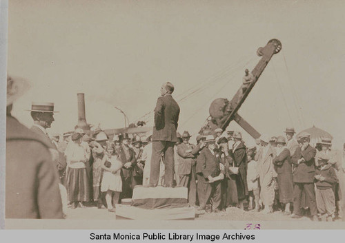 Reverend Charles Scott speaking to a crowd at the ceremonies marking the completion of grading on Beverly (Sunset) Blvd. from Los Angeles to Pacific Palisades, August 18, 1925