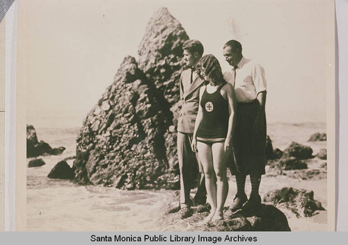 USC Swimmer Lee Harrison in front of Haystack Rock, with Coaches Nichols and Gilliland