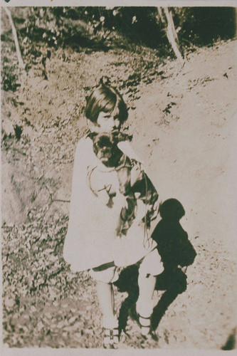 Pearl Pickham with a dog in Pacific Palisades, Calif