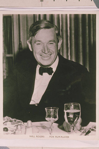 Portrait of Will Rogers "Fox Film Player" at a dinner