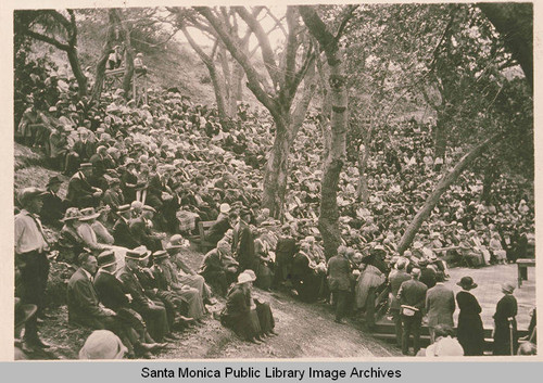 A crowd gathering at the amphitheater at Sylvan Glen, Assembly Camp, Pacific Palisades, Calif