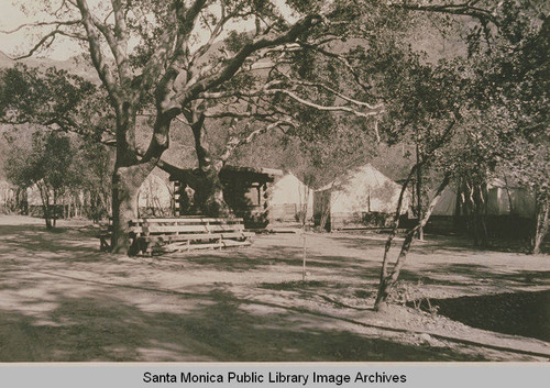 Casitas and tents for Chatauqua are in view among the oaks at Assembly Camp, Temescal Canyon, Calif