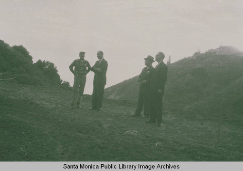 Public school officials looking over the site for the building of Palisades High School in Temescal Canyon