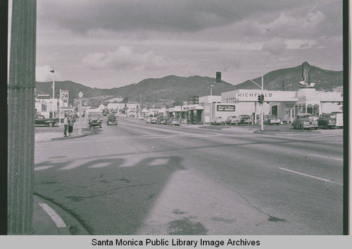 Downtown Pacific Palisades Business District at the intersection of Sunset Blvd. and La Cruz Drive showing a Richfield service station on the right