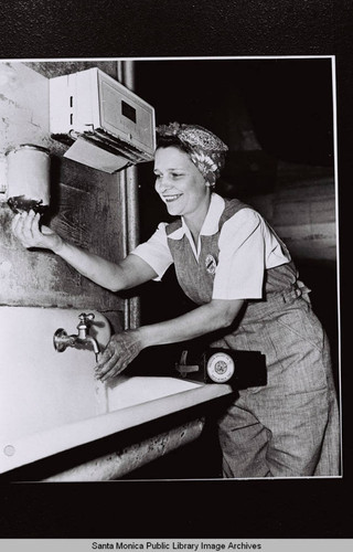 Douglas Aircraft Company Santa Monica plant employee washing her hands, World War II