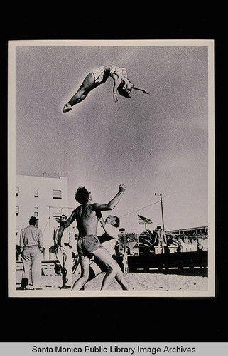 Lee Thompson and Russ Saunders throwing Paula Dell on Muscle Beach, Santa Monica, Calif