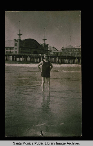 Fraser Pier which later became Pacific Ocean Park showing the Breakers Cafe on the Pier and an unidentified bather in foreground