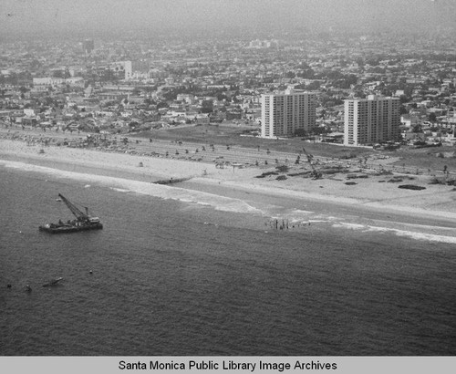 View of the remains of the Pacific Ocean Park Pier and Santa Monica Shores Apartments looking northeast toward Santa Monica, July 10, 1975, 2:30PM