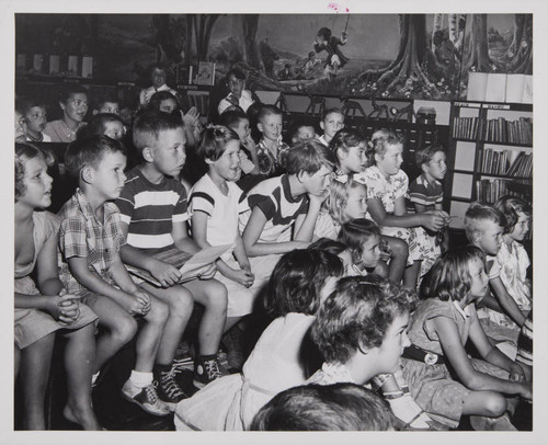 Children watching a performance in the Boys and Girls Room