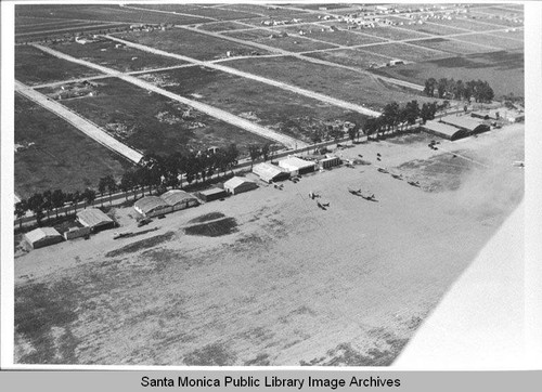 Aerial view of Douglas Aircraft Company Santa Monica plant and planes on Clover Field