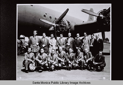 Group portrait of the Aircraft War Production Council's Advisory Committee on production representing leading Southern California airplane manufacturers visiting the Douglas Aircraft Company plant (manufacturers include Lockheed, North American, Vega, Consolidated, Vultee, Northrop and Douglas) during World War II