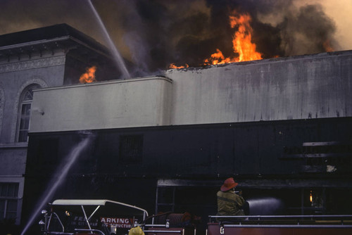 Firefighters battling a blaze at Thrifty Drug Store at 326 Wilshire Blvd