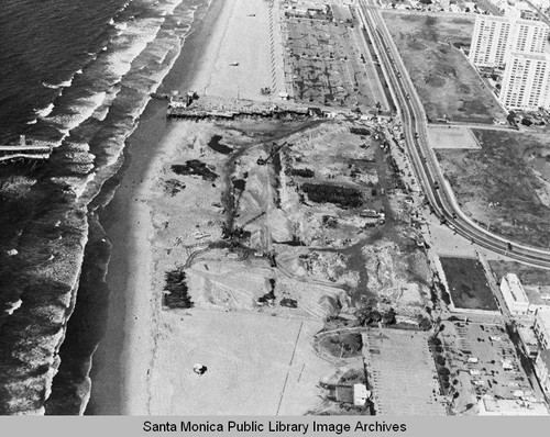 Remains of the Pacific Ocean Park Pier looking north to a beach parking lot, February 10, 1975, 11:30 AM