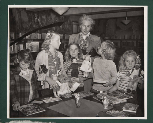 Author Margaret Leighton with a group of girls in the Boys and Girls Room