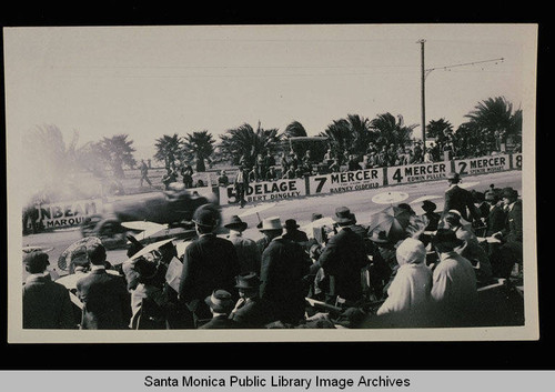 Spectators watching the Santa Monica automobile road race on Ocean Avenue